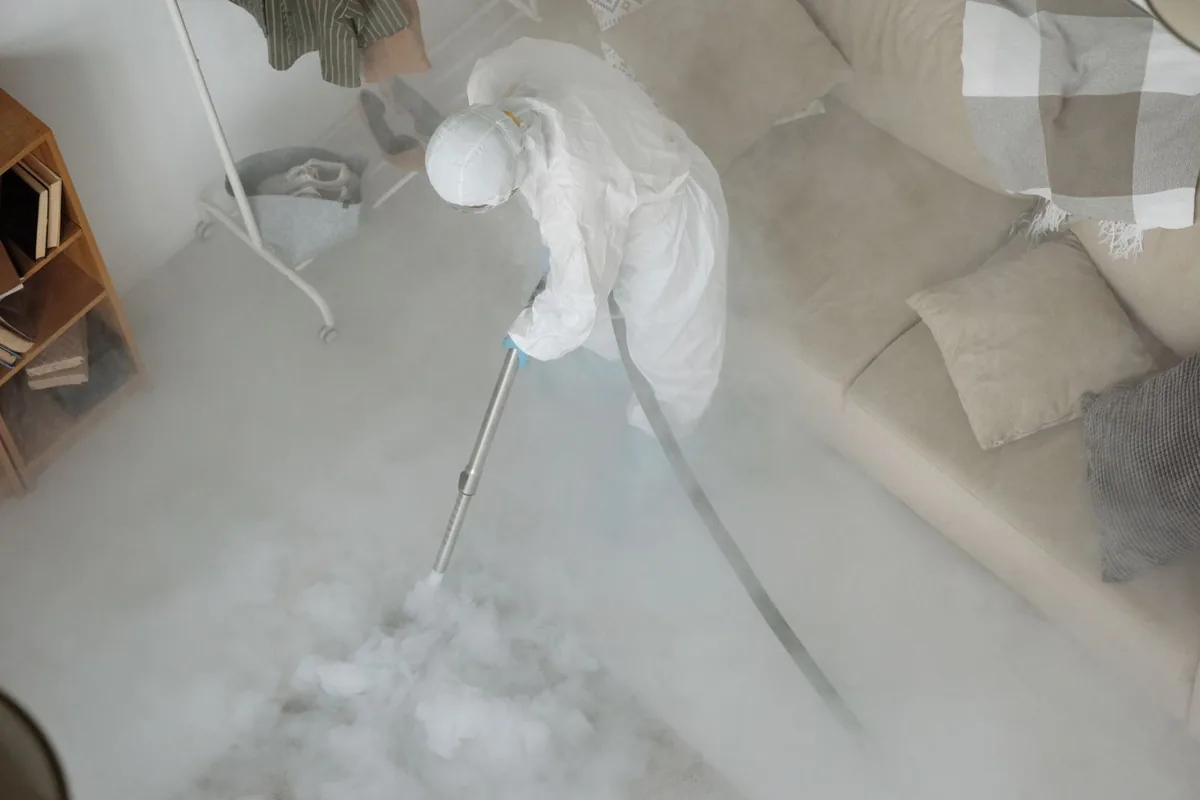 Biohazard cleanup technician in protective equipment, Lenoir City, TN